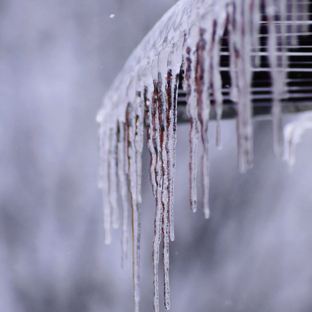 snow removal and gutter maintenance to prevent roof ice dams