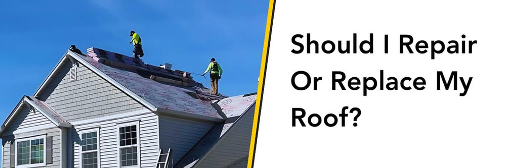 Roof repair or replacement - roofers on a roof